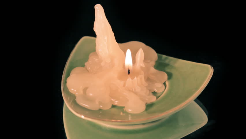 Melting Candle Close-up, On Completely Black Reflective Surface Stock 