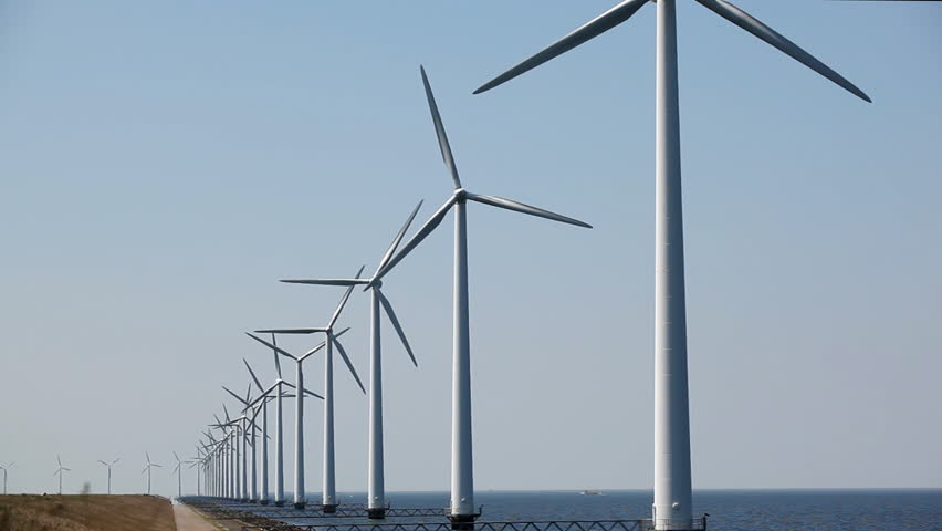 Field Of Single Blade Wind Turbines In Function On A Windy Day Stock