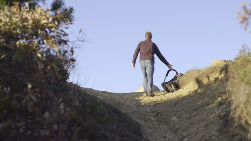 Man Walking Uphill Stock Footage Video 2130764 Shutterstock