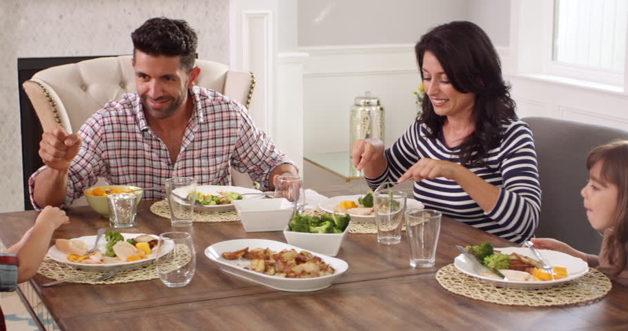 Cute Family Dining Together At The Table In The Kitchen Stock Footage