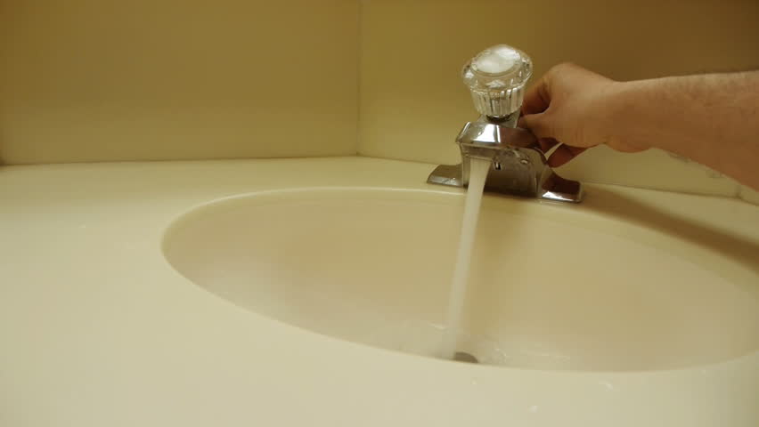 bathroom sink fills up with water