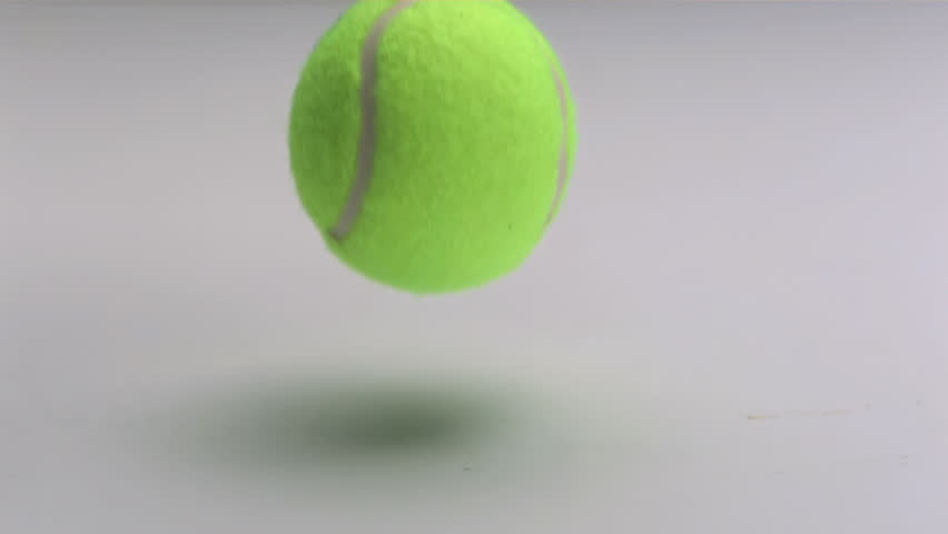 Tennis Ball Slow Motion Dropping And Bouncing On White Background Stock