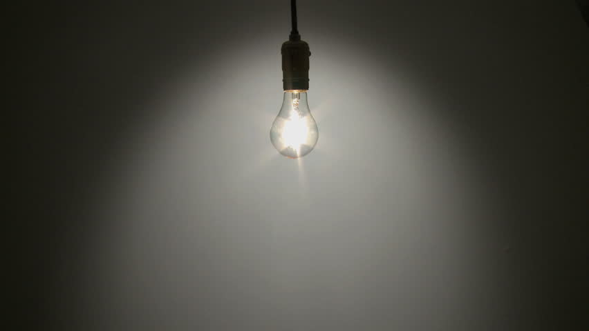 A Light Bulb Illuminates A Dark Room, Much Like An Idea In ...