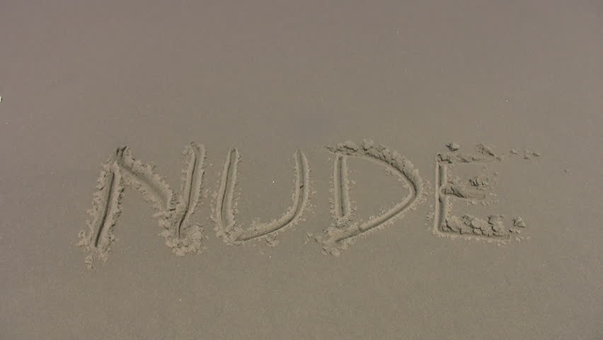 Video Of The Word Nude Scratched In Sand Of Beach Waves Washing The