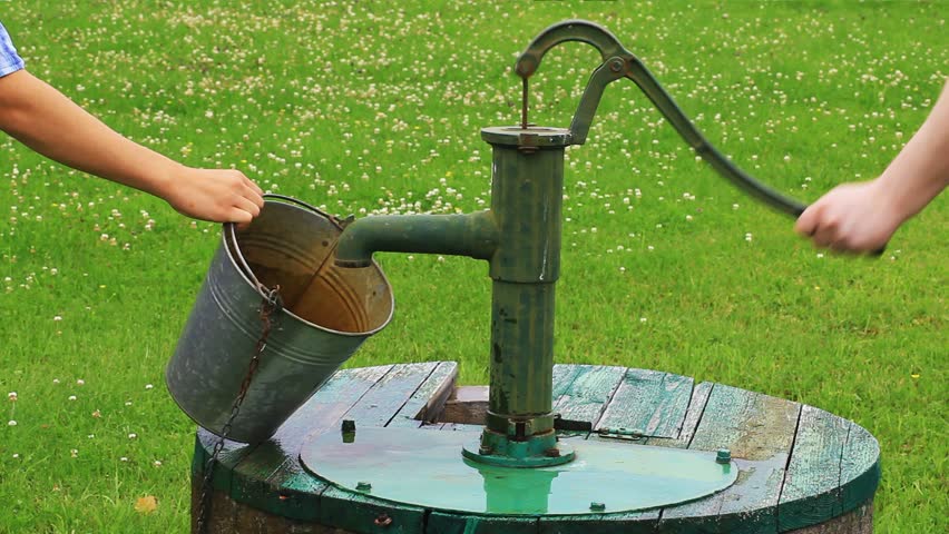 man-powered-water-pump-at-the-well-stock-footage-video-4171897