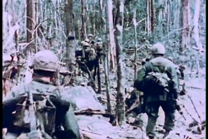 1960s The Fourth Infantry Division Battles Enemy Forces During The Vietnam War Stock Footage 