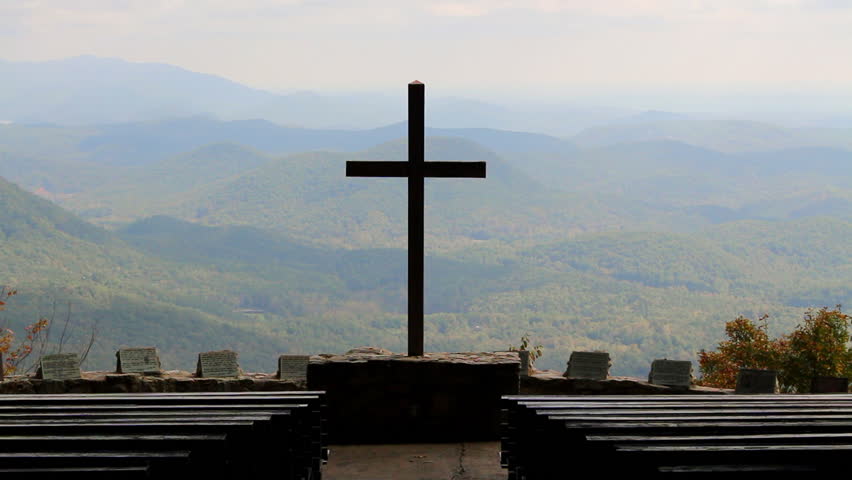 A Silhouette Of The Cross From An Outdoor Church Over