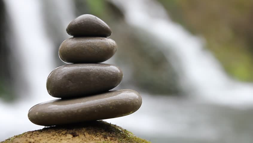 stacked zen stones and waterfall stock footage video stacked zen stones and waterfall stock footage video