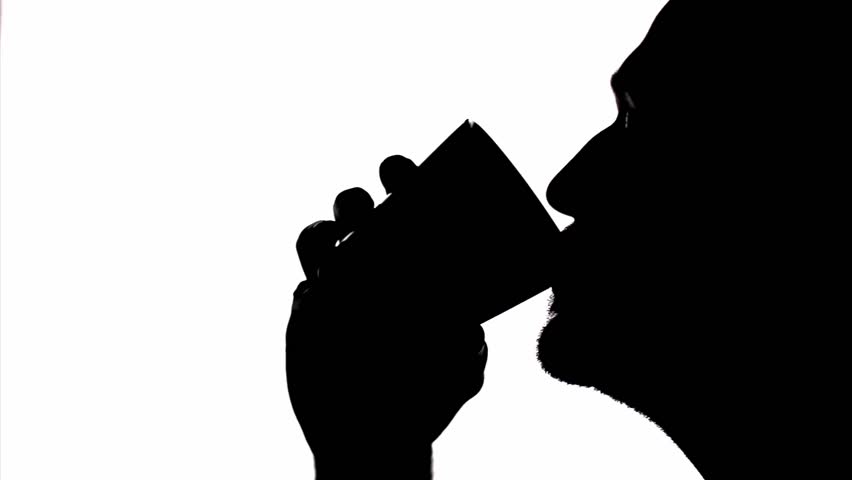 Silhouette Young Man Is Drinking With A Cup. Stock Footage Video 