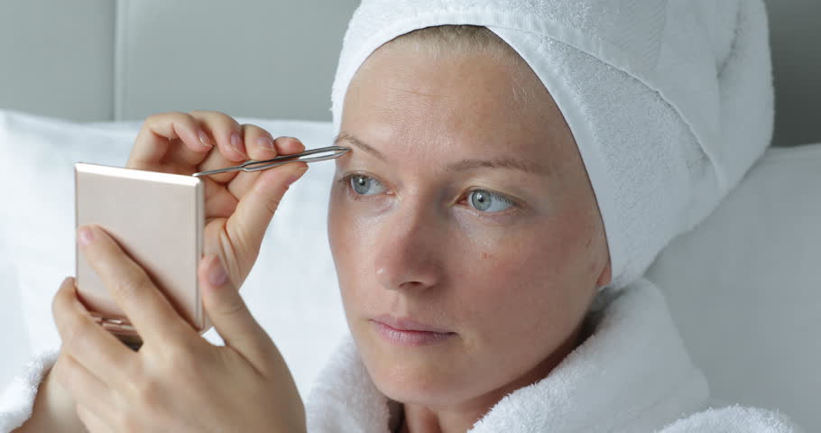Removing One Unwanted Gray Hair Using Tweezers Stock Footage Video 3187078 Shutterstock