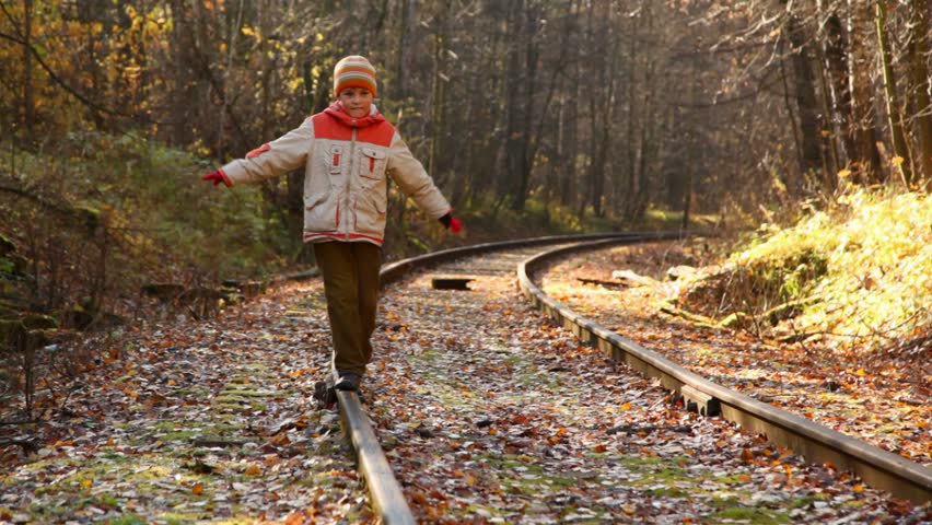 Video Of A Business Man Walking On A Railroad Track At The Middle Of