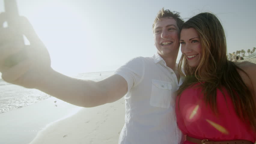 Couple Takes Selfie On Beach With Smartphone Romantic