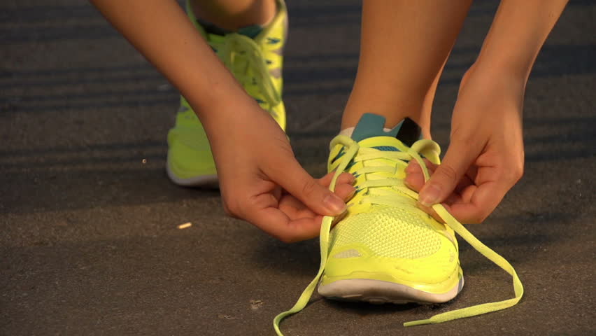 Intoxicated Young Adult Man Sits Barefoot On The Sidewalk