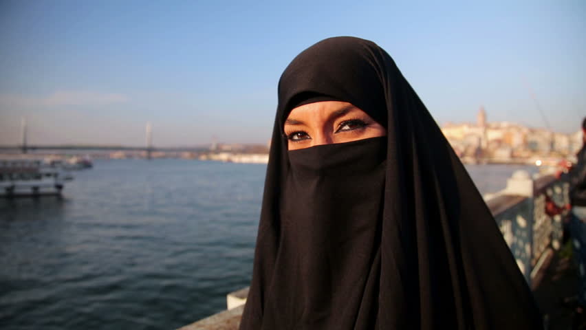 Woman Dressed With Black Headscarf, Chador On Istanbul 