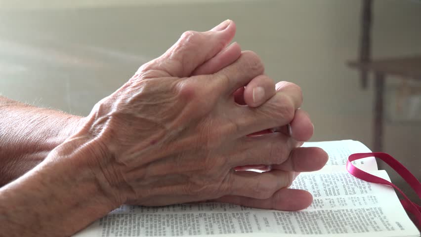 Old Lady Hands Holding A Catholic Rosary Or Cucifix And Praying To God