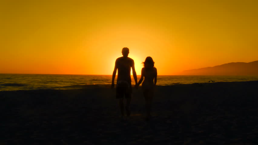 Couple Walking Along Summer Beach At Sunset Stock Footage Video 2526950