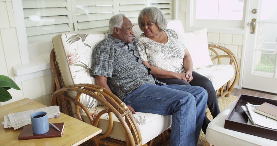 Senior Black Couple Sitting On Couch Talking 4k Stock