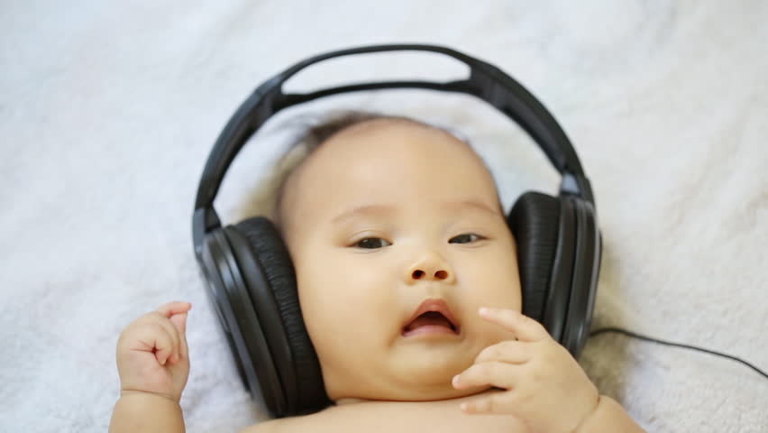 Baby Listening To Headphones Stock Footage Video 10555556 - Shutterstock