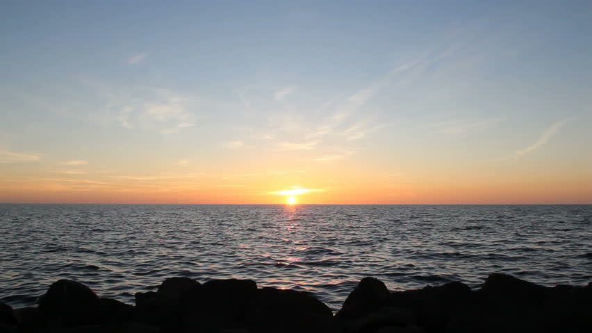 The Bright Sun Is Setting Over Water With Gentle Waves Stock Footage ...