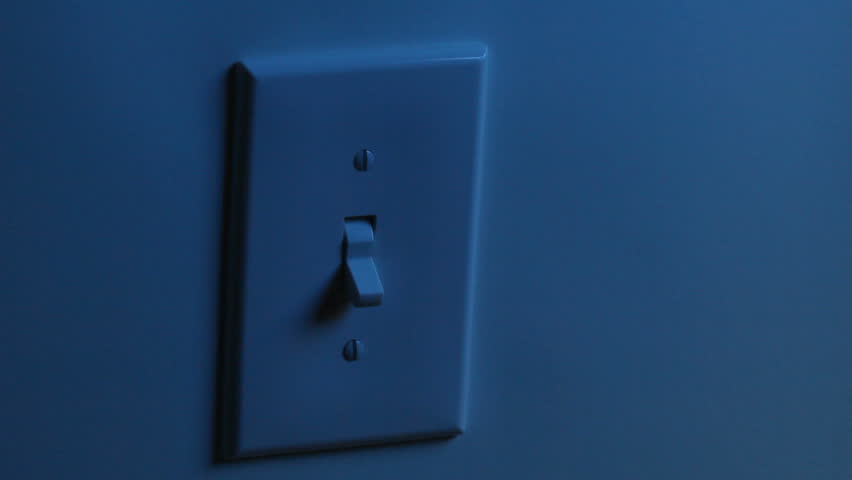 A Women's Hand Flips A Light Switch On, And Then Turns It Off. Two ...