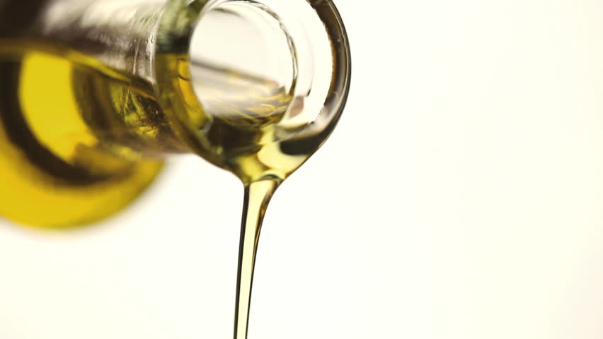 close up of bottle pouring olive oil - HD stock video clip