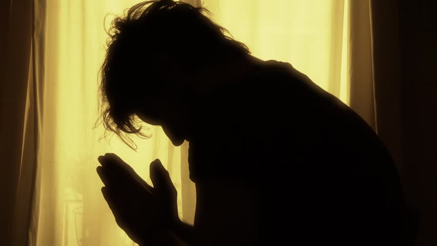 Man Praying At Night Backlit Silhouette. Backlit Silhouette Of A ...