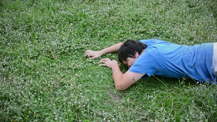 An Asian Thai Male Man Guy Is Drop Dead On The Grassy Ground Field From ...