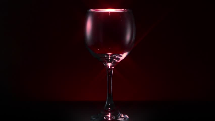 Two Glasses Of Red Wine Being Poured On Black Background Stock Footage ...