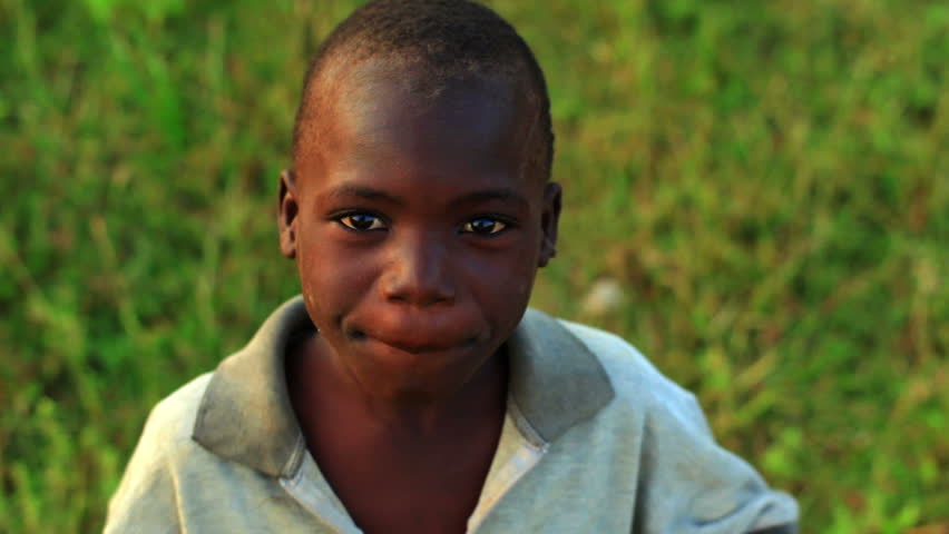 KENYA, AFRICA - CIRCA 2009: A Young African Boy With A Serious ...