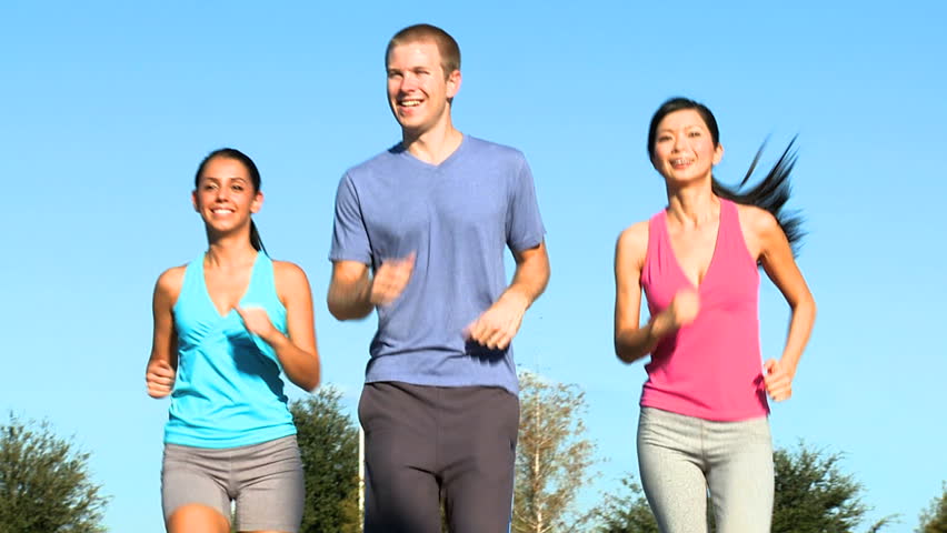 Three Fit Young People Keeping Fit Jogging Together Stock Footage Video ...