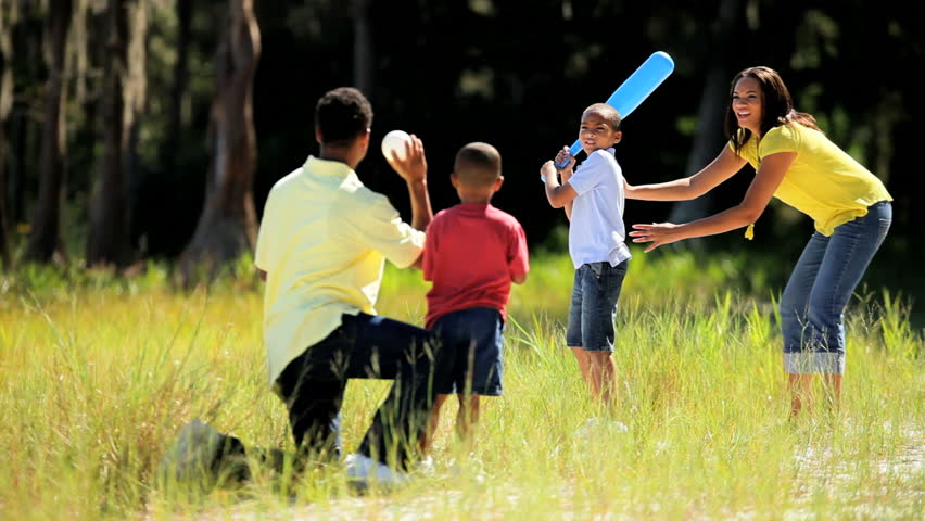 Healthy Young Ethnic Family Having Fun Playing Baseball Together In The ...