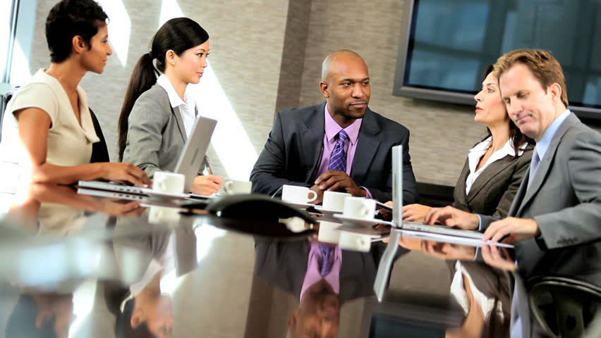 Team Of Five Multi Ethnic Business People In City Clothes Meeting In A ...