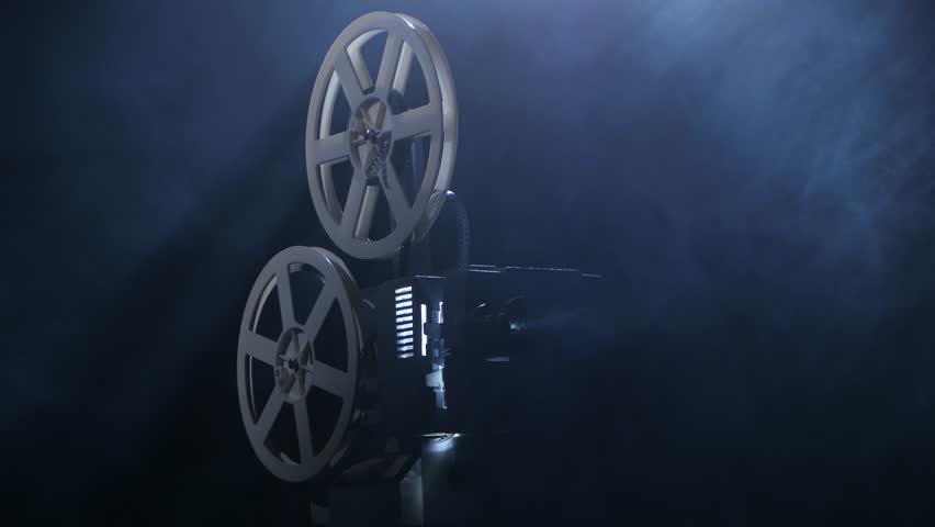 Wide Shot Of 16mm Film Projector At Start Up With Projection Beam Stock ...