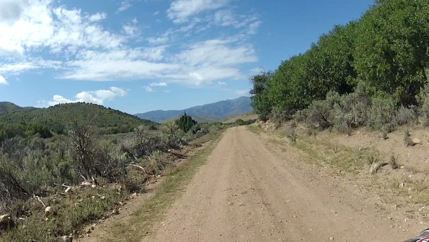 Driving ATV Mountain Dirt Road. Summer Recreation Sport Riding An All ...