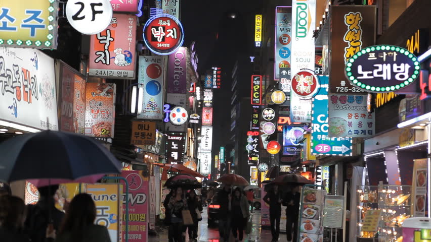Seoul, South Korea - Nov 22, 2011: People Walk Through A Street Of ...