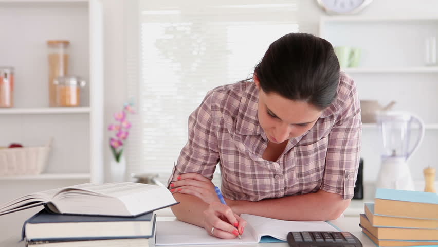 Studying Woman With Books And Calculator Smiling At Home Stock Footage ...