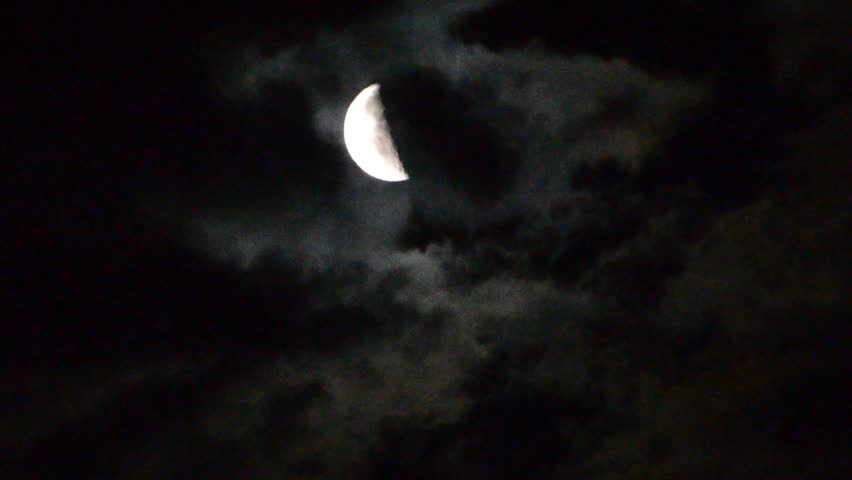 Dark Night Sky With A Full Moon Shining Bright As Clouds Move Across ...