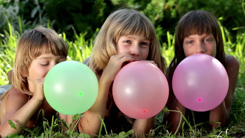 Child Blowing Up A Balloon Outdoors Stock Footage Video 3091741 ...