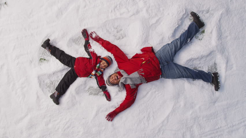 Father And Son Making Snow Angels Stock Footage Video 4662959 ...