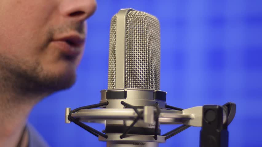 Man Speaking Into Studio Microphone. Close-up Shot Stock Footage Video ...