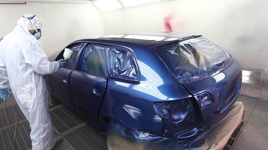 Footage Of A Car Being Painted And Varnished In A Painting Chamber ...