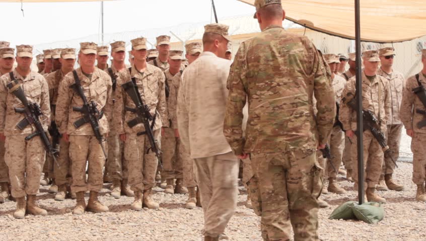 Afghanistan, Circa 2011: Officer Salutes And Brings Marine Squad To At ...