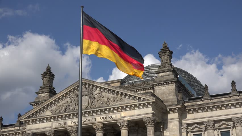 Low Angle Shot Of German Flag In Front Of The Reichstag In Berlin, UHD ...