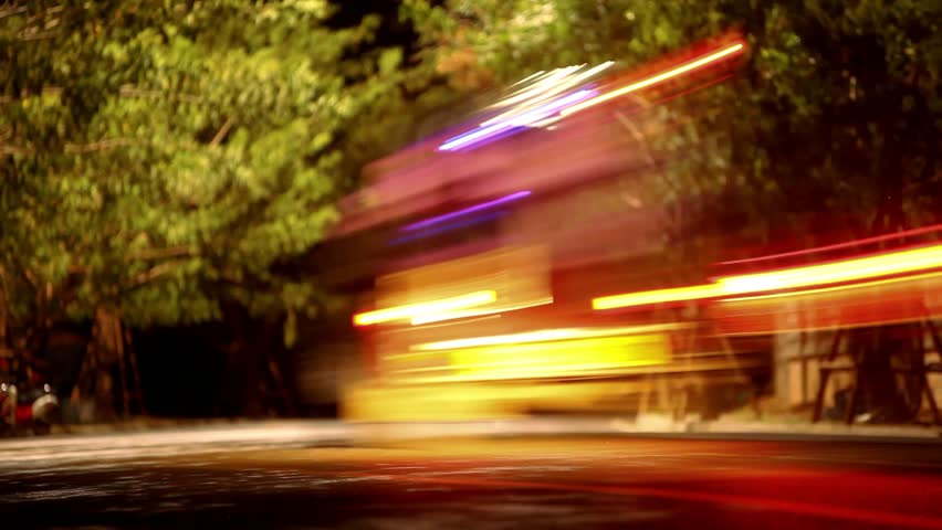 Night Traffic With A Slow Shutter Speed And Crowd Of People Walking On ...