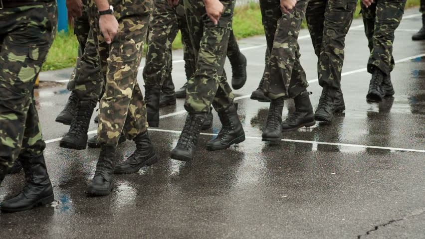 Close-up Of Soldiers Feet As They March Through Forest Stock Footage ...