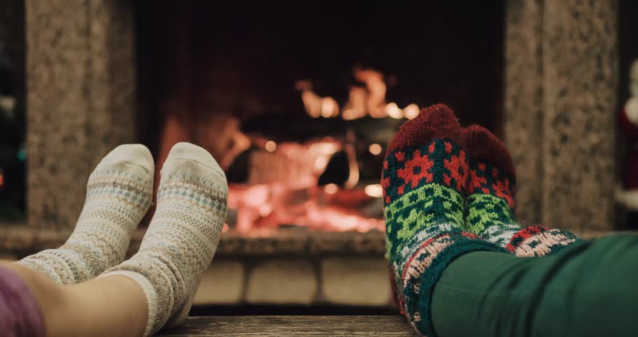 Feet In Woolen Socks Warming By Cozy Fire In Christmas Time In Slow ...