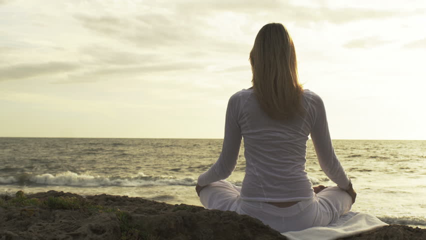 Silhouette Young Woman Practicing Yoga On The Beach At Sunset ...