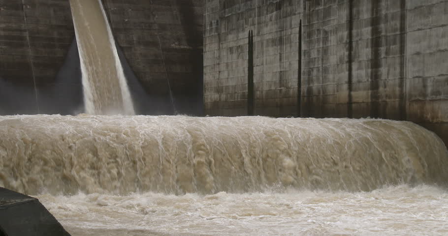 Flood Waters Flow Through Hydroelectric Dam. Flood Waters Flow Through ...