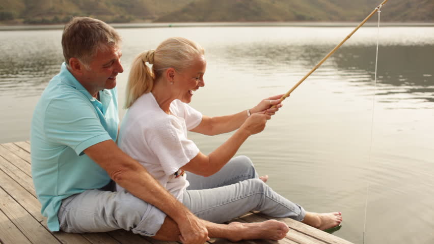 Mature Couple Fishing By Lakeside Stock Footage Video 8172997 ...