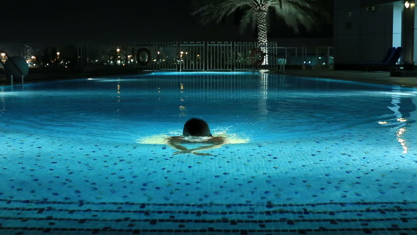 Attractive Blonde Women Swimming A Luxury Pool At Night Stock Footage ...